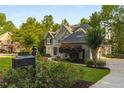 Charming home with manicured landscaping, flowering bushes, and distinctive mailbox at 4789 Crest Park Ln, Marietta, GA 30068