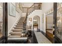Elegant foyer with grand staircase, dark hardwood floors, and soaring ceilings welcomes you home at 4789 Crest Park Ln, Marietta, GA 30068