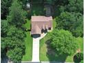 An aerial view highlights the home's well-manicured lawn and landscaping with a small shed in the backyard at 106 Kimbell Farm Dr, Locust Grove, GA 30248