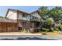 Charming brick apartment complex with Tudor details, private patios, and well-maintained landscaping at 1225 Church St # M, Decatur, GA 30030