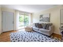 Bright living room features stylish furniture and direct access to a private balcony at 1225 Church St # M, Decatur, GA 30030
