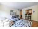 Inviting living room features stylish decor, hardwood floors, and a convenient pass-through to the kitchen at 1225 Church St # M, Decatur, GA 30030