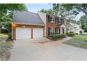Lovely home showcasing a spacious driveway leading to an attached two-car garage at 2683 Berry Ridge Ct, Buford, GA 30519