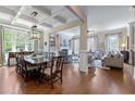 Open-concept living and dining area with coffered ceilings and abundant natural light at 2283 Falmouth Se Ct # 22, Smyrna, GA 30080