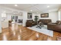 Inviting living room features hardwood floors, coffered ceilings, and a seamless flow to the outdoor patio at 321 Crabtree Court, Marietta, GA 30068