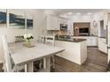 Bright kitchen featuring granite counters, stainless steel appliances, and breakfast area at 35 Westfair Ct, Atlanta, GA 30328