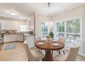 Cozy breakfast nook with chandelier lighting and bright window views at 2348 Logan Ne Cir, Brookhaven, GA 30319