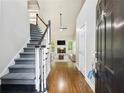 Inviting foyer with hardwood floors, stairway, and view into the bright living room at 2348 Logan Ne Cir, Brookhaven, GA 30319