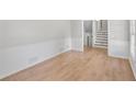 Bright living room with light wood floors and white wainscoting offers a clean, inviting space at 1260 White Oak Se St, Conyers, GA 30013