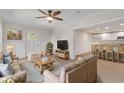 Cozy living room with a view to the kitchen, complete with comfortable seating and a ceiling fan at 356 Lake Dr, Atlanta, GA 30354