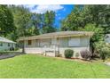 Charming single-story home with a quaint front porch and a well-maintained lawn at 2083 Meador Se Ave, Atlanta, GA 30315