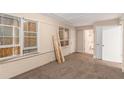 Inviting living room featuring new carpet and easy access to the bathroom at 2083 Meador Se Ave, Atlanta, GA 30315