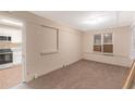 Inviting living room featuring new carpet and view into the kitchen at 2083 Meador Se Ave, Atlanta, GA 30315
