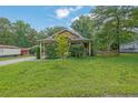 A lovely home with an expansive lawn and mature landscaping at 219 1St St, Woodstock, GA 30188