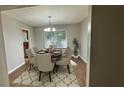 Traditional dining room with hardwood floors, six chairs and modern chandelier at 4550 Cypress Ridge Ct, Stone Mountain, GA 30083
