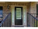 Close up of a front door with sidelights and black hardware at 3015 Guardian Nw Walk, Kennesaw, GA 30152