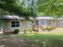 Inviting single-story home featuring well-maintained lawn and front yard landscaping at 4434 Janice Dr, Snellville, GA 30039