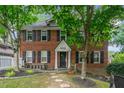 Charming two-story brick home featuring black shutters and a well-maintained front yard at 830 Barnett Ne St # 2, Atlanta, GA 30306