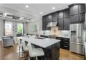 Spacious kitchen with marble countertops, stainless steel appliances, and a breakfast bar at 328 Brownstones Cir, Atlanta, GA 30312