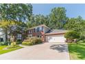 Attractive brick home with a two-car garage and a long driveway at 4105 Vicksburg Dr, Lawrenceville, GA 30044