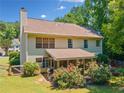 The home features a screened porch and a spacious backyard that is perfect for entertaining and outdoor activities at 5340 Harris Creek Dr, Cumming, GA 30040