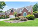Well-maintained brick home featuring lush landscaping and a two-car garage at 3812 Mine Creek Ln, Marietta, GA 30062