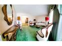 Classic living room boasting vintage decor, ornate mirrors, and plush carpeting at 3769 Amber Nw Rd, Atlanta, GA 30331