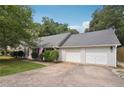 Well-maintained single-story home with a two-car garage and an American flag displayed on the porch at 600 Cowan Rd, Covington, GA 30016