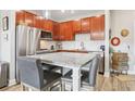 Stylish kitchen showcasing cherry cabinets, granite counters, and stainless steel appliances at 840 United Se Ave # 205, Atlanta, GA 30312
