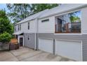 Rear exterior of home with attached two car garage and upper level patio area at 183 Cleveland # B, Atlanta, GA 30316