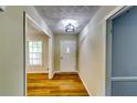 Bright hallway boasts new floors and fresh paint throughout the home at 516 Jordan Nw Dr, Tucker, GA 30084
