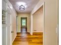 Bright hallway boasts new floors and fresh paint throughout the home at 516 Jordan Nw Dr, Tucker, GA 30084