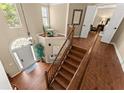 Second floor foyer view with staircase, chandelier, and hardwood floors at 1520 Dorchester Dr, Lawrenceville, GA 30043