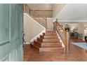 Inviting foyer with hardwood floors and staircase leading to the upper level at 1520 Dorchester Dr, Lawrenceville, GA 30043