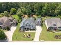 Stunning home with pristine landscaping, long driveway, and mature tree coverage at 4875 Churchill Ridge Dr, Cumming, GA 30028