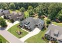 Beautiful home with professionally landscaped yard, long driveway, and mature tree coverage at 4875 Churchill Ridge Dr, Cumming, GA 30028