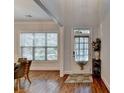 Welcoming entryway featuring hardwood floors, a decorative rug, and a charming front door with a window at 1668 Legrand Cir, Lawrenceville, GA 30043