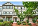 Inviting townhome featuring well-maintained landscaping and classic architectural details at 3641 Princeton Ave, Atlanta, GA 30337