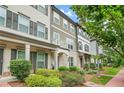 Attractive townhome with manicured landscaping, a small balcony, and brick accents at 3641 Princeton Ave, Atlanta, GA 30337