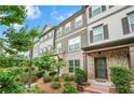 Beautiful townhome with lush landscaping, a brick facade, and a welcoming entrance at 3641 Princeton Ave, Atlanta, GA 30337