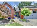 Close-up of brick home with double front doors, meticulous landscaping, and attached garage at 510 Elgaen Ct, Roswell, GA 30075
