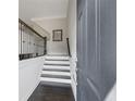 Bright entryway with hardwood floors, elegant staircase, and modern railing creating a welcoming ambiance at 5504 Cameron Parc Dr, Alpharetta, GA 30022