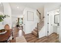 Welcoming entryway with hardwood floors, staircase, and stylish decor at 1001 Starmoss Ln, Conyers, GA 30094