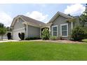 Lovely single-story home featuring a lush green lawn, beautiful landscaping, and a welcoming entrance at 2871 Goldfinch Cir, Marietta, GA 30066