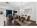 Open concept living and dining room featuring hardwood floors, recessed lighting, and stylish decor at 2161 Colvin Ct, Atlanta, GA 30318