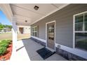 Inviting covered front porch with stone accents and neutral siding for relaxing at 416 Blue Sky Cir, Acworth, GA 30102