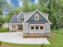 Charming two-story home with a well-manicured lawn, showcases a modern design with a blend of traditional elements at 331 Terrell Sw Dr, Marietta, GA 30064