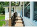 Inviting entryway with stone steps, dark shutters, and modern accents at 3388 Elgin Dr, Decatur, GA 30032
