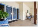Inviting front porch featuring a decorative security door and two wicker chairs for relaxing outdoors at 2302 Springside Way, Decatur, GA 30032