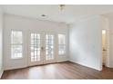 Spacious living room featuring hardwood flooring and light-filled French doors at 1731 Pryor Sw Rd # 307, Atlanta, GA 30315